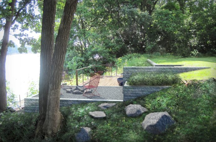 A serene landscape featuring a stone patio, grassy areas, and surrounding trees near water.